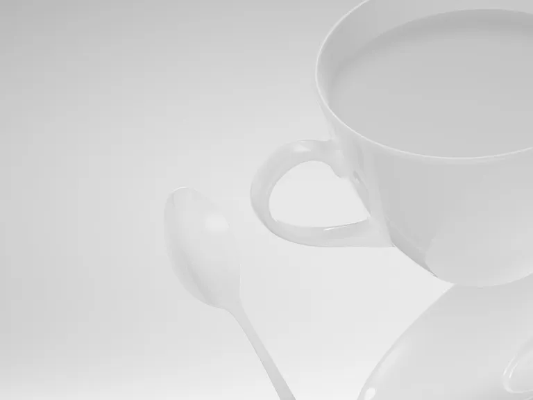 Visualisierung einer Kaffeetasse und Kaffeelöffel im High Key Foto-Stil